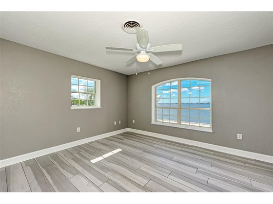 First floor Bedroom left side - Single Family Home for sale at 949 Suncrest Ln, Englewood, FL 34223 - MLS Number is D6120396