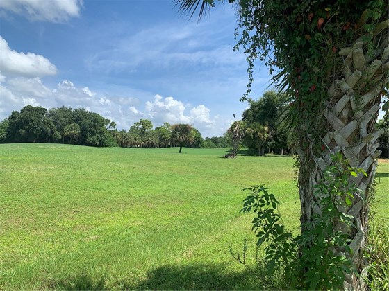 Looking right from the backyard at the 3rd hole, par 58 - Vacant Land for sale at 35 Long Meadow Pl, Rotonda West, FL 33947 - MLS Number is D6121391