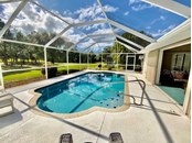 Caged Pool and Lanai - Single Family Home for sale at 11 Long Meadow Rd, Rotonda West, FL 33947 - MLS Number is D6121957