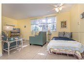 Spacious Living Room with Space for Daybed in Lower Unit - Duplex/Triplex for sale at 4076 N Beach Rd #10 & 11, Englewood, FL 34223 - MLS Number is D6122744