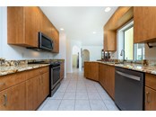 LOTS OF CABINETS, GORGEOUS GRANITE TOPS, STAINLESS APPLIANCES - Single Family Home for sale at 3400 Colony Ct, Punta Gorda, FL 33950 - MLS Number is C7451906
