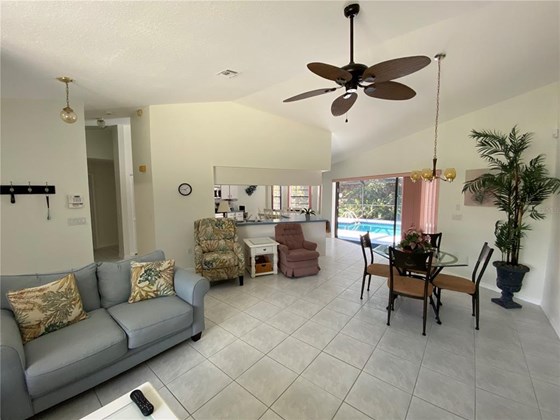 Standing in the living room. - Single Family Home for sale at 18506 Hottelet Cir, Port Charlotte, FL 33948 - MLS Number is C7452138