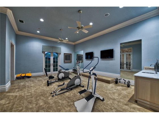 Fitness Room with Wet Bar - Single Family Home for sale at 8499 Lindrick Ln, Bradenton, FL 34202 - MLS Number is A4475594