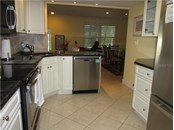 KITCHEN OPENED INTO DINING AREA - Condo for sale at 1087 W Peppertree Dr #221d, Sarasota, FL 34242 - MLS Number is A4493593