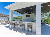 Bar area at the Cabana...great to watch your favorite game on the big screen! - Single Family Home for sale at 602 Regatta Way, Bradenton, FL 34208 - MLS Number is A4499642