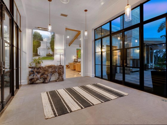 Custom-made, solarium style door and windows for sweeping views of the Bay. - Single Family Home for sale at Address Withheld, Bradenton, FL 34209 - MLS Number is A4509547
