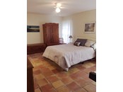 Master Bedroom with Spanish tile - Single Family Home for sale at 7700 Iguana Dr, Sarasota, FL 34241 - MLS Number is A4512842