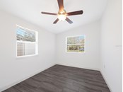 The spacious and bright second bedroom features vaulted ceilings. - Single Family Home for sale at 3070 Hatton St, Sarasota, FL 34237 - MLS Number is A4518301