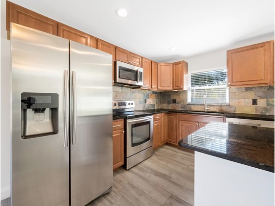 Kitchen features all Samsung stainless steel appliances. - Single Family Home for sale at 3070 Hatton St, Sarasota, FL 34237 - MLS Number is A4518301