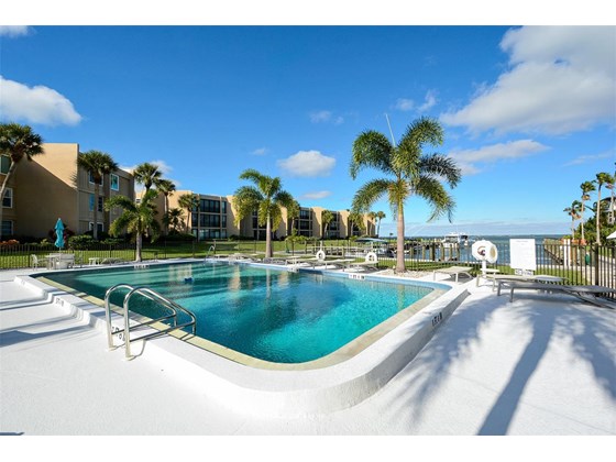 Pool, Pool Deck, Grill to the right.  Kayak launch to the right - Condo for sale at 450 Gulf Of Mexico Dr #B107, Longboat Key, FL 34228 - MLS Number is A4520786