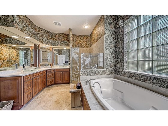 Jetted soaking tub, walk-in shower, double vanity with vessel sinks, separate water closet - Single Family Home for sale at 8821 Misty Creek Dr, Sarasota, FL 34241 - MLS Number is A4521942