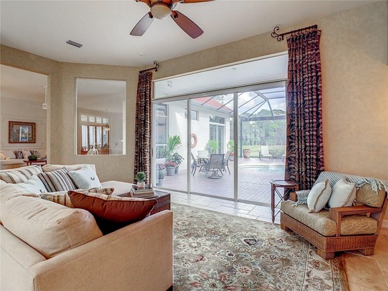 Even from the family room the newer panoramic screen on the lanai provides amazing views - Single Family Home for sale at 319 Stone Briar Creek Dr, Venice, FL 34292 - MLS Number is A4522164