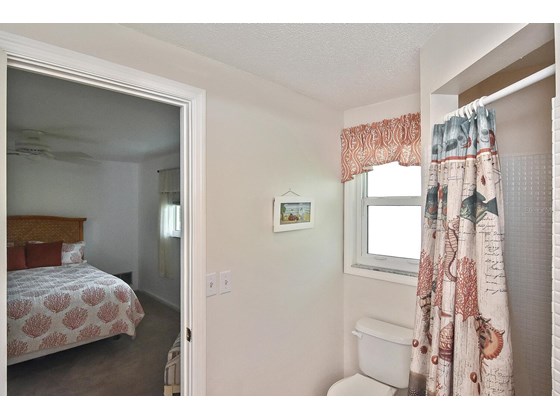 Master bathroom to master bedroom - Single Family Home for sale at 19 Oakwood Dr N #19, Englewood, FL 34223 - MLS Number is N6118266